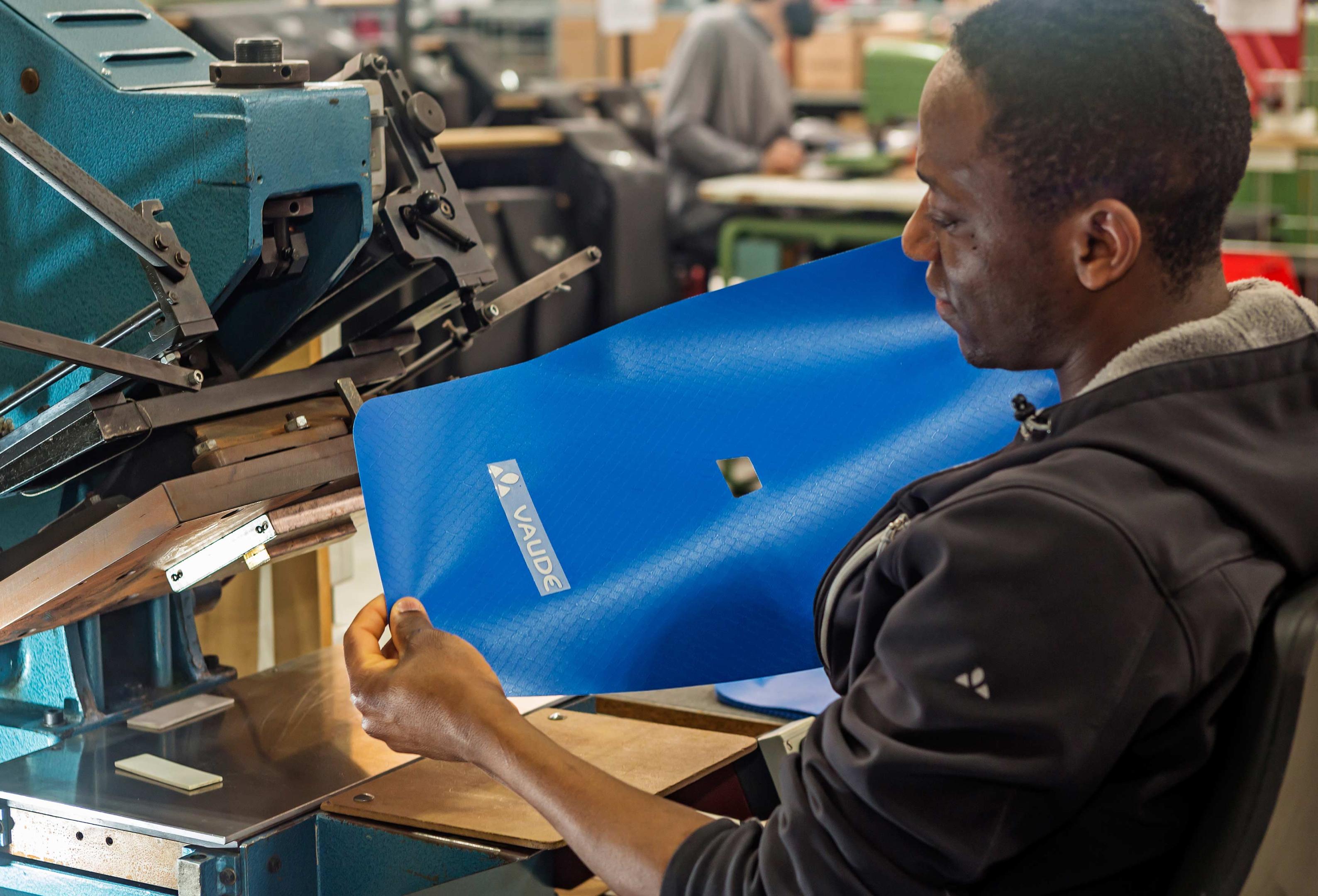 Man working on a bike bag